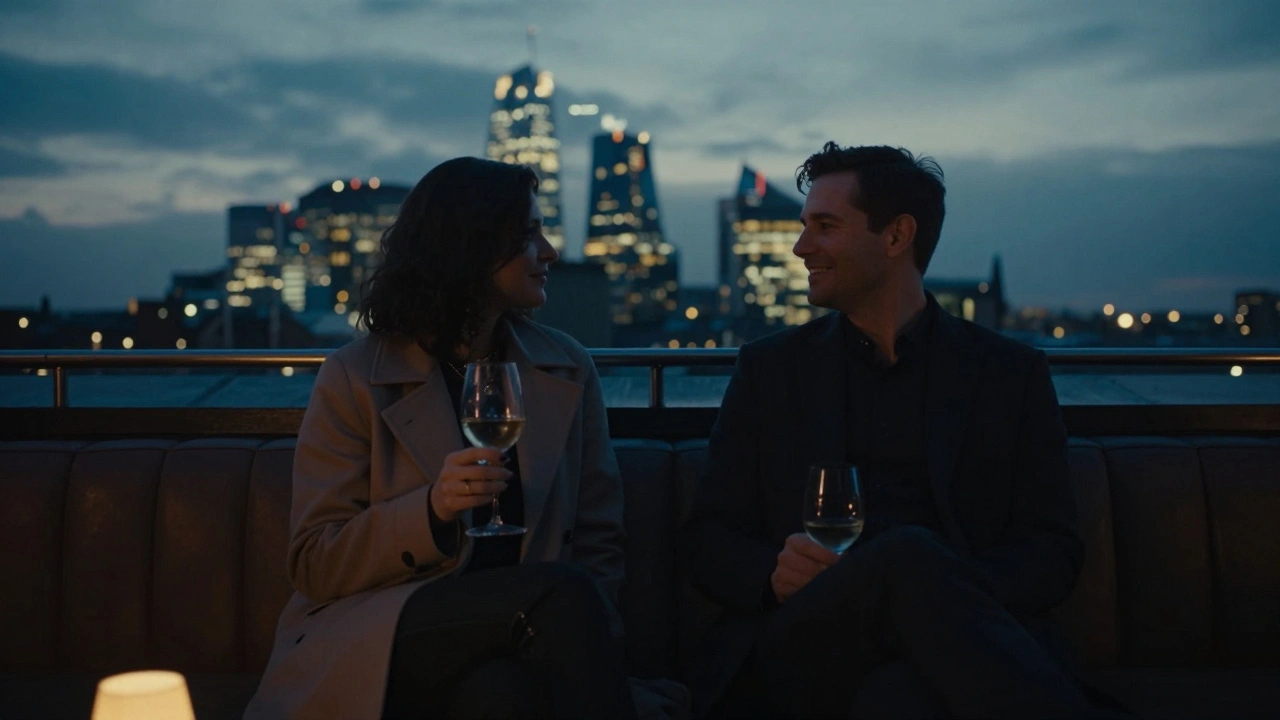 A man and woman silhouetted together on a rooftop bar in Shoreditch, overlooking London’s glowing skyline at dusk.