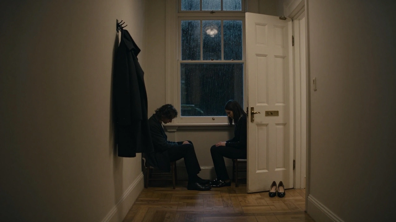 Two silhouettes sit in silent communion in a dimly lit London townhouse, conveying deep emotional connection without touch.