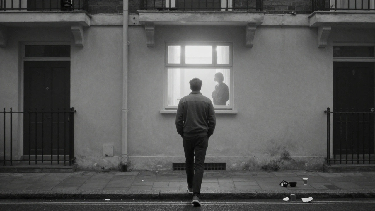A man walks away from an apartment building at dawn, visibly lighter, as a silhouette watches from behind a glowing window.